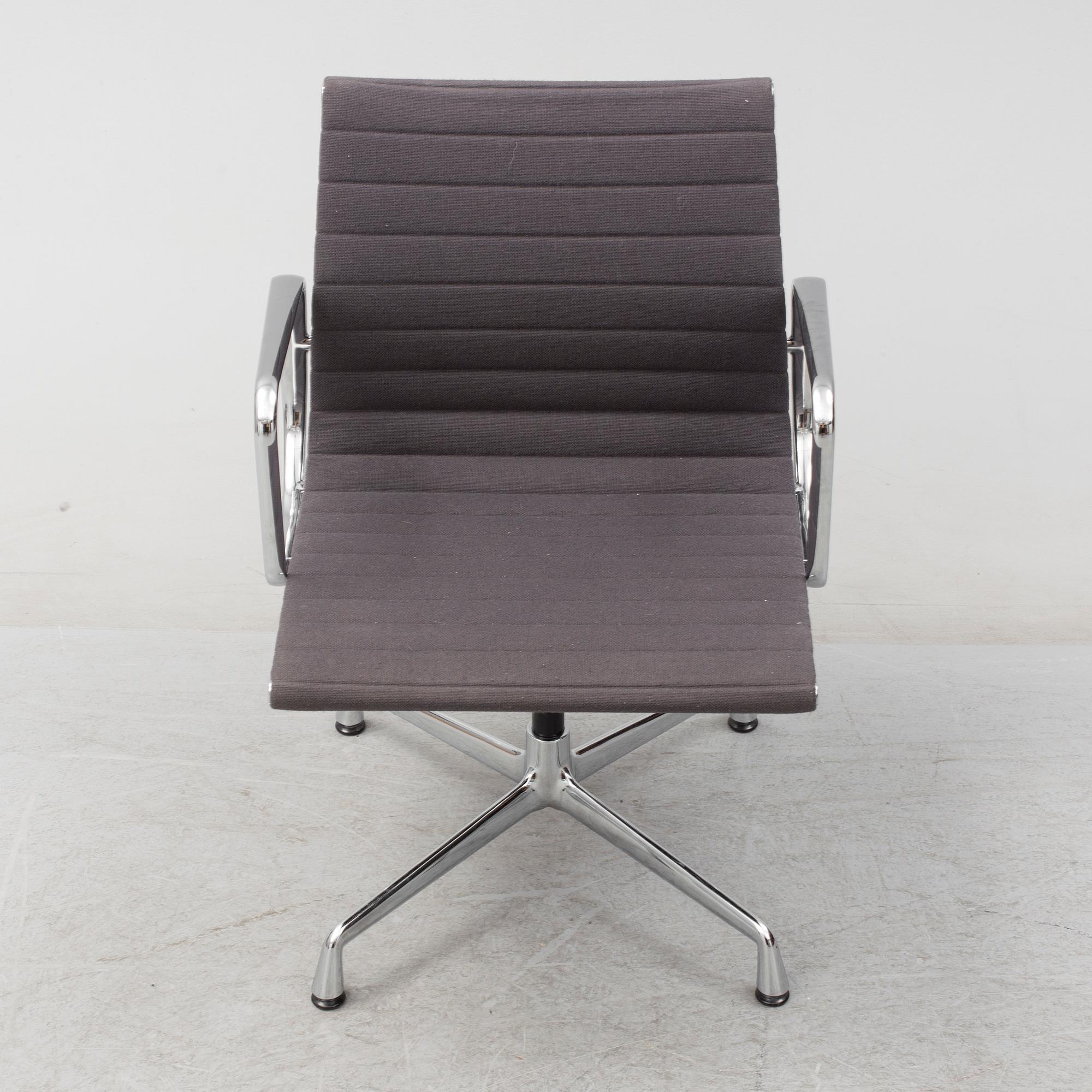 An 'EA 104 Swivel' armchair by Charles & Ray Eames, Vitra, 2007.