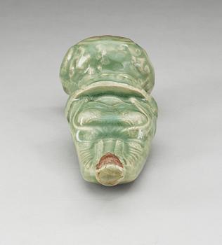 A celadon glazed figure of Guanyin, Ming dynasty.
