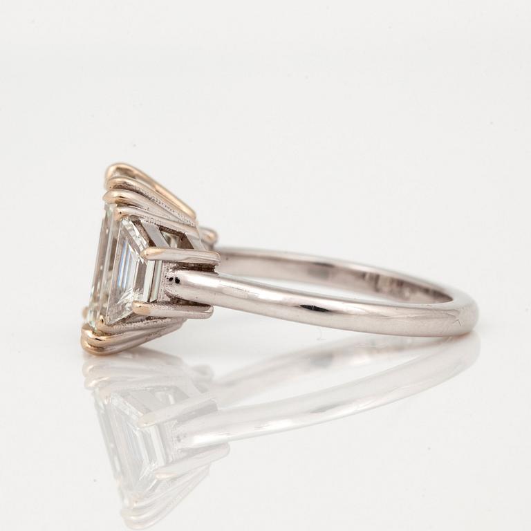 A 4.05ct emerald cut diamond ring. Quality circa I/VS.