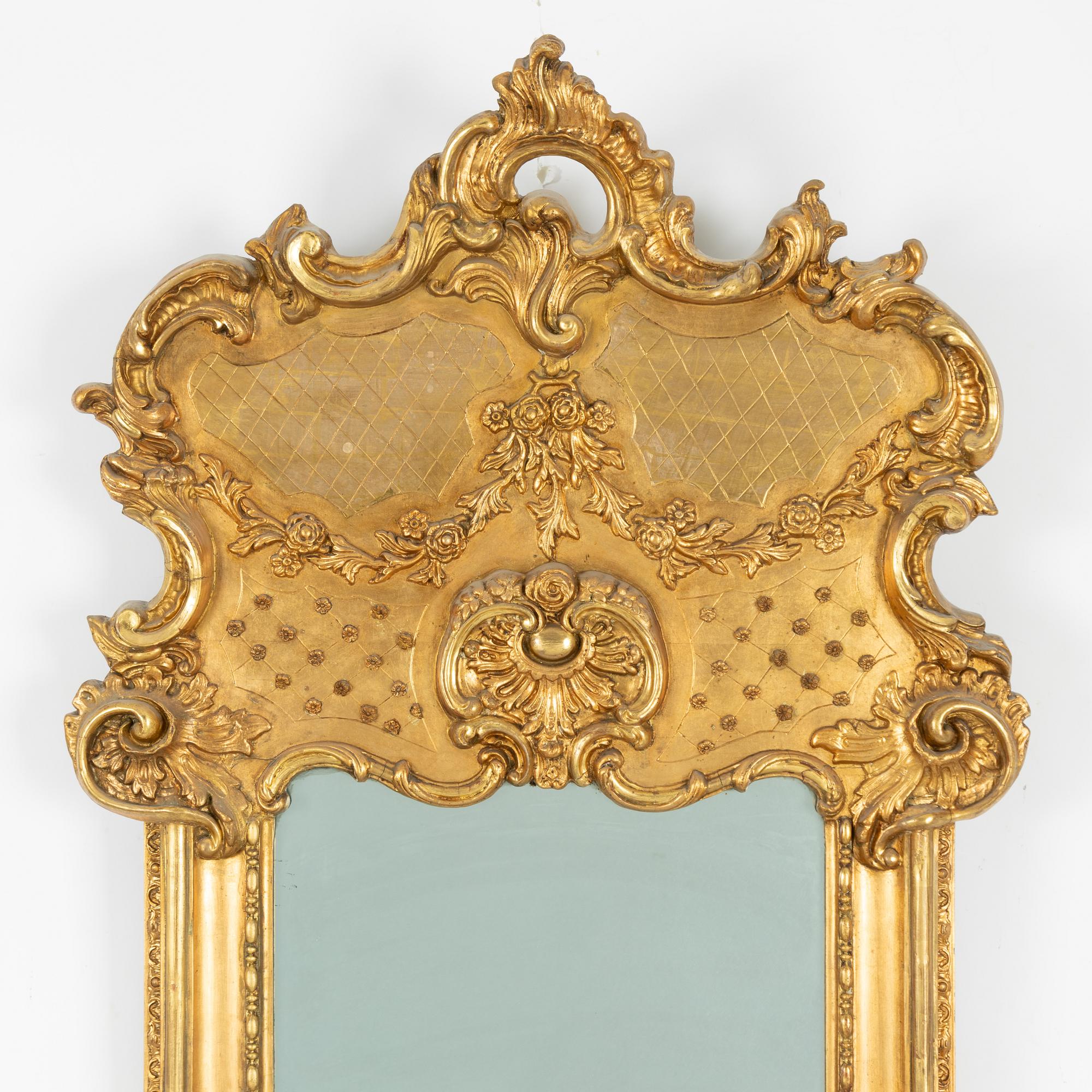 A Rococo style mirror, second half of the 19th Century.