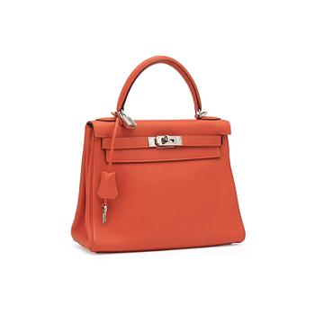 HERMÈS, a orange Togo leather "Kelly" handbag.