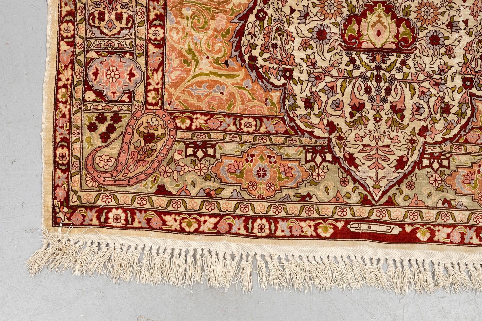 A rug, Old silk Hereke, ca 152 x 110 cm.