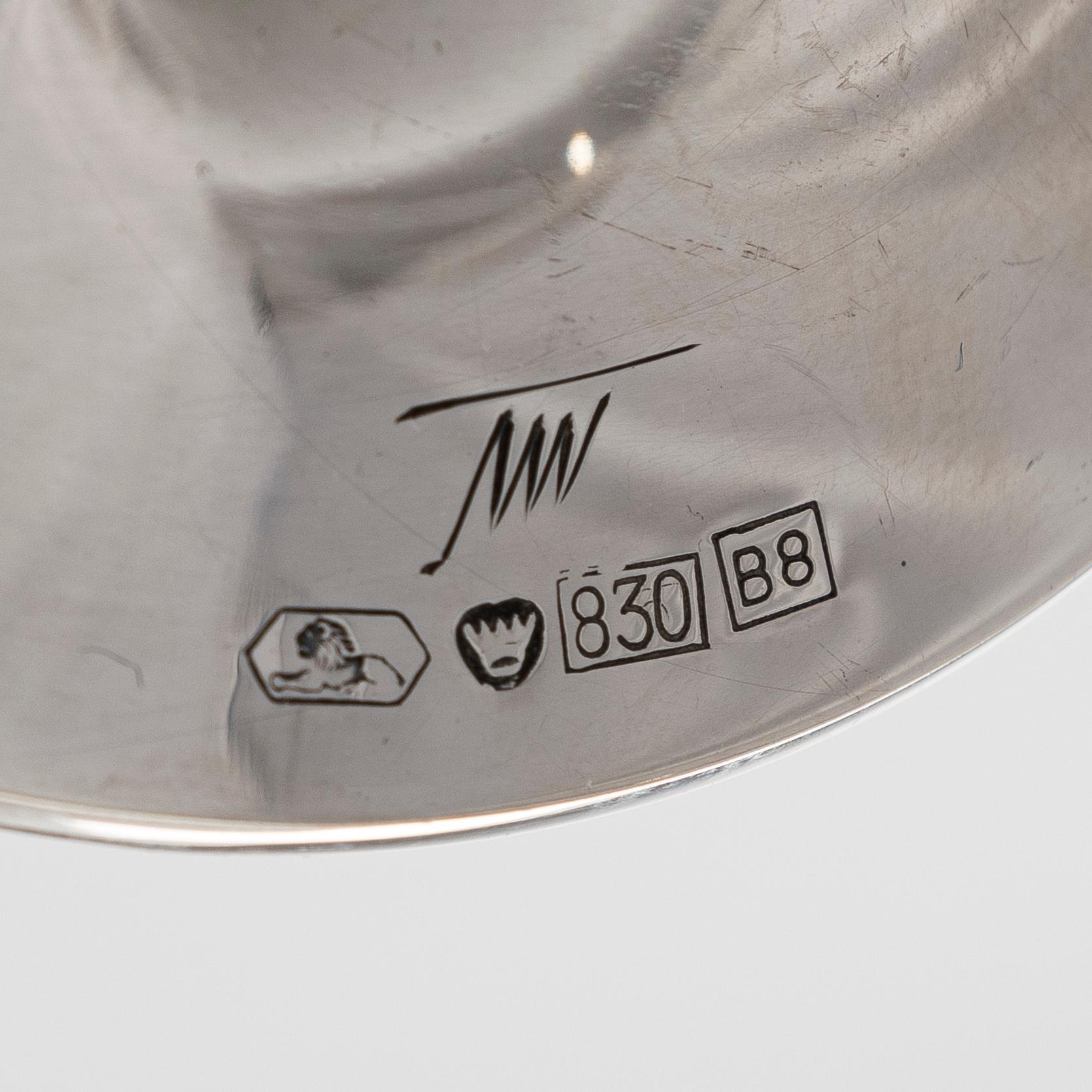 Tapio Wirkkala, A set of four silver candlesticks, "Trumpetti", Kultakeskus, Hämeenlinna 1979 and 1990.