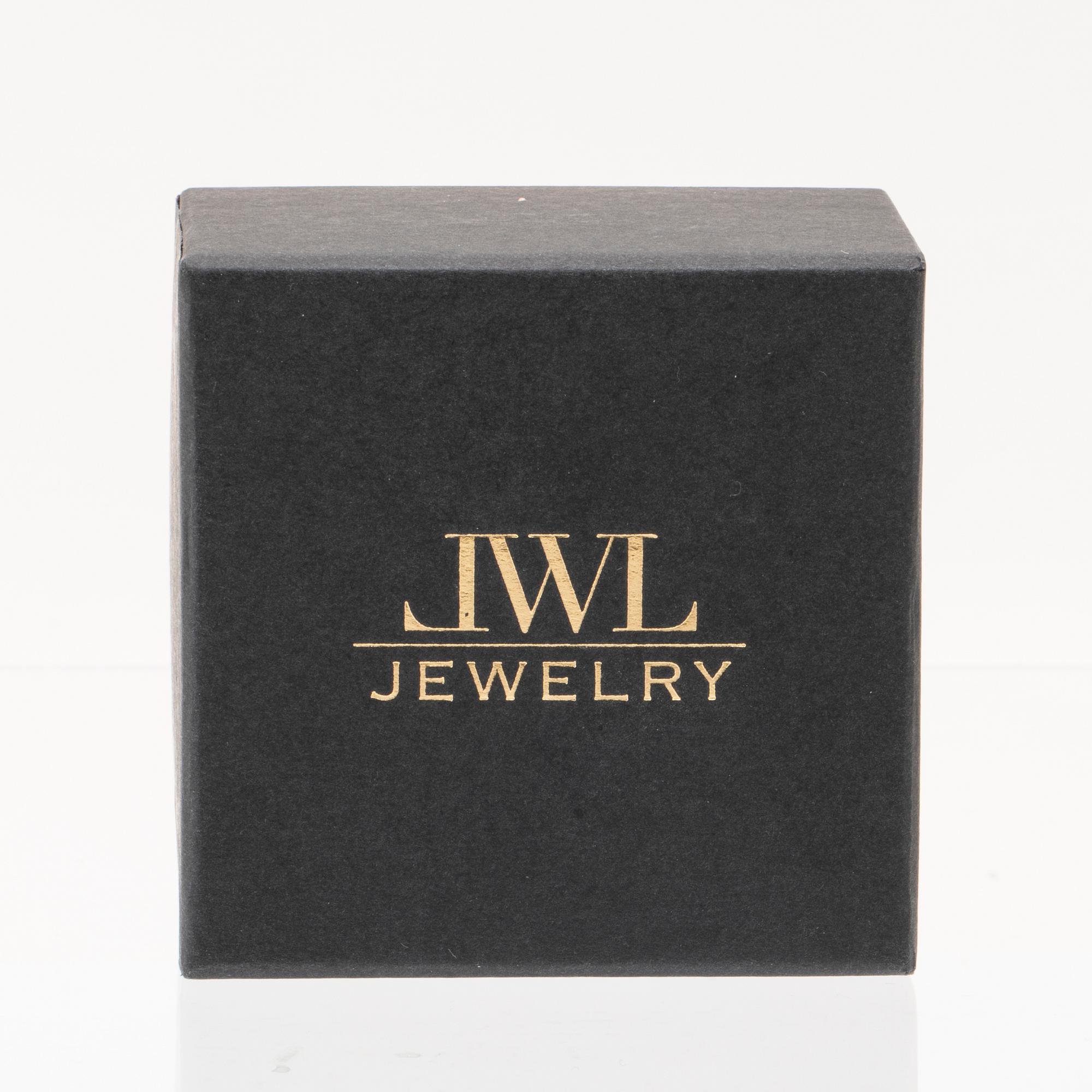 An 18K gold ring set with an oval cut and round brilliant cut diamonds by LWL Jewelry.
