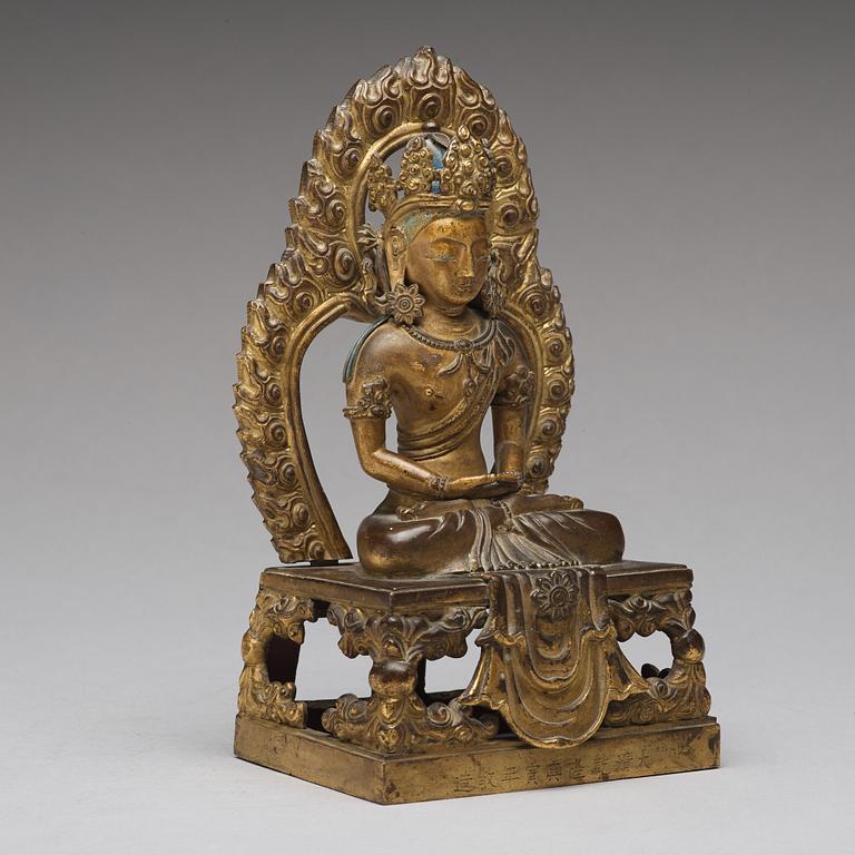 A gilt bronze seated figure of Amitayus, Qing dynasty, Qianlong period, dated by inscription.