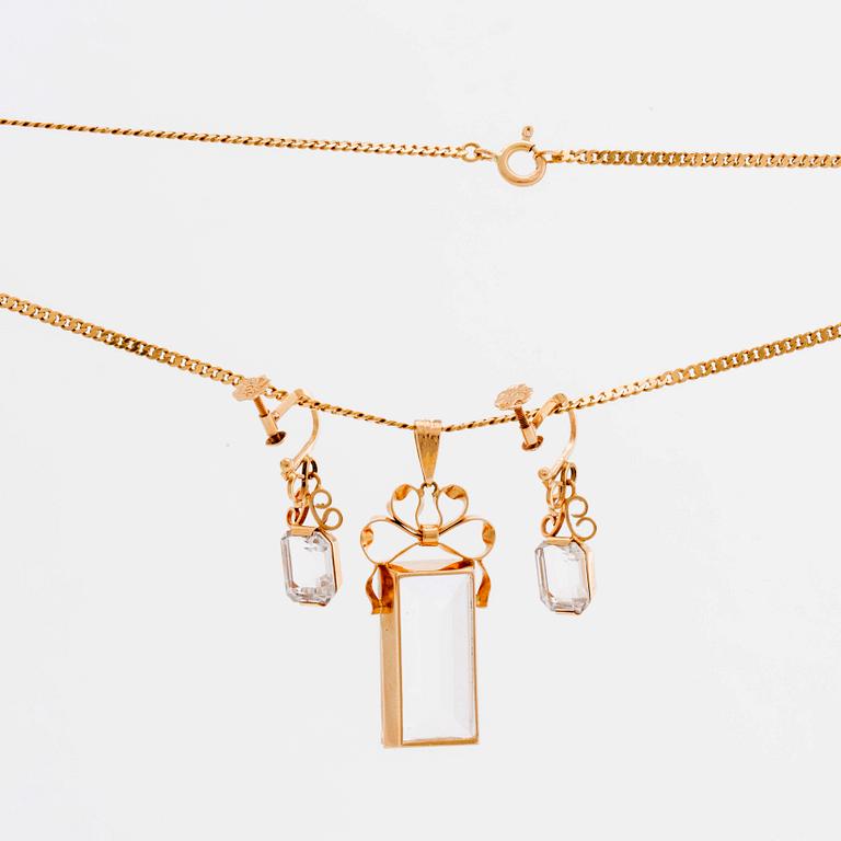 STIGBERT chainn and pendant and earrings, 18l gold and rock crystal.