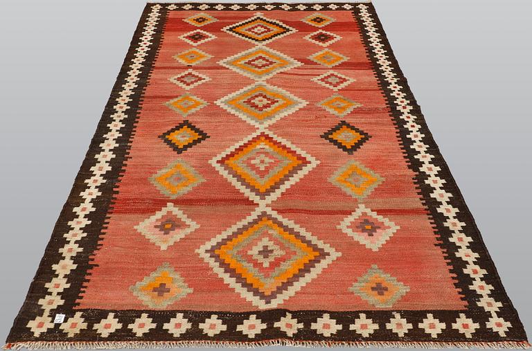A kurdish nomad kilim, ca 277 x 138 cm.