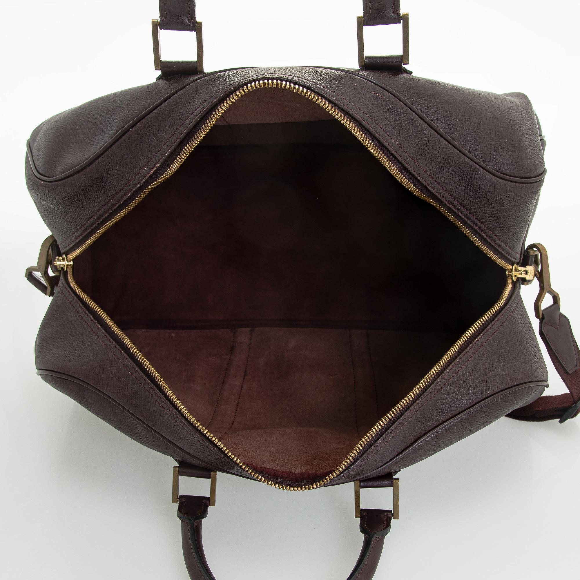 Louis Vuitton, a 'Taiga Kendall PM' weekend bag.