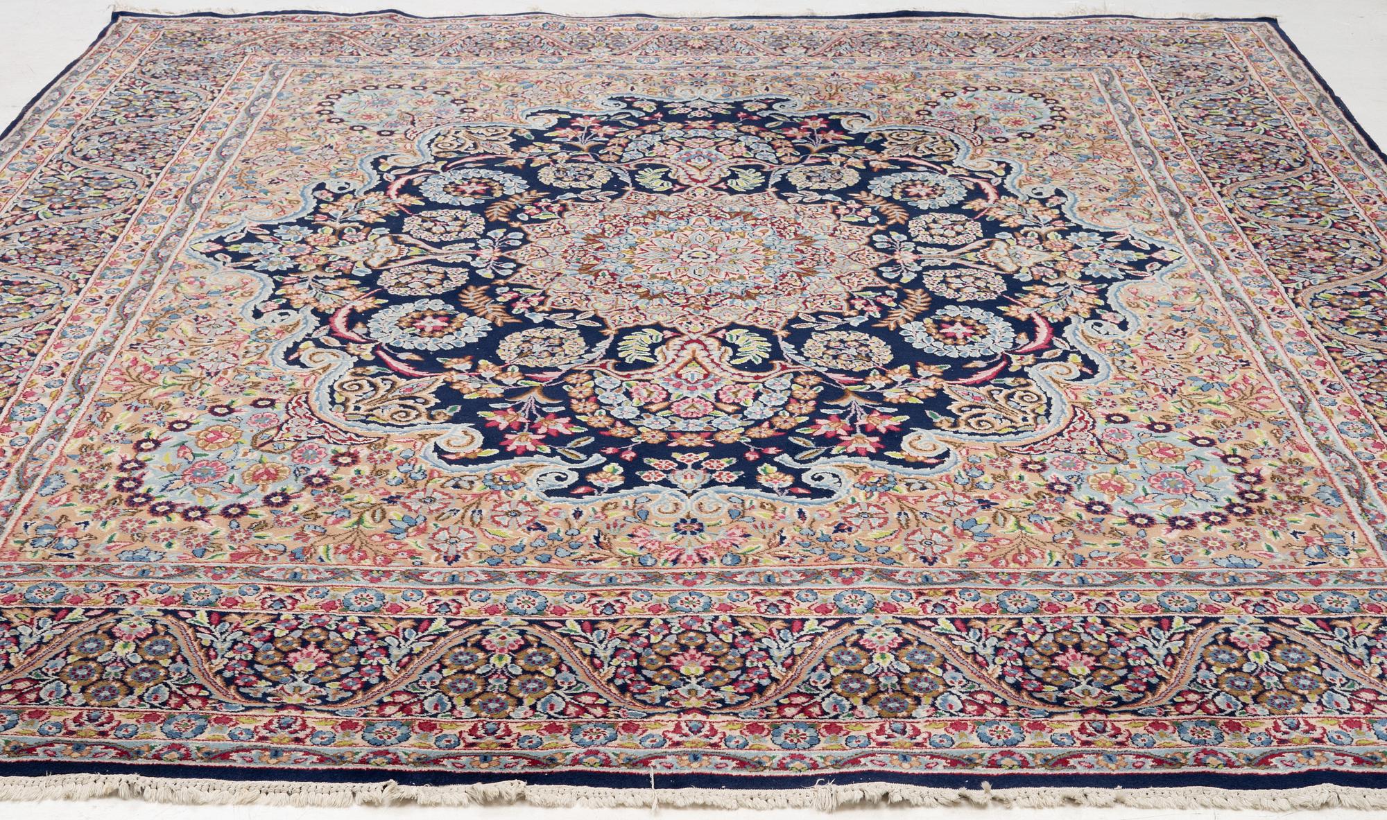 An oriental carpet, c. 385 x 300 cm.