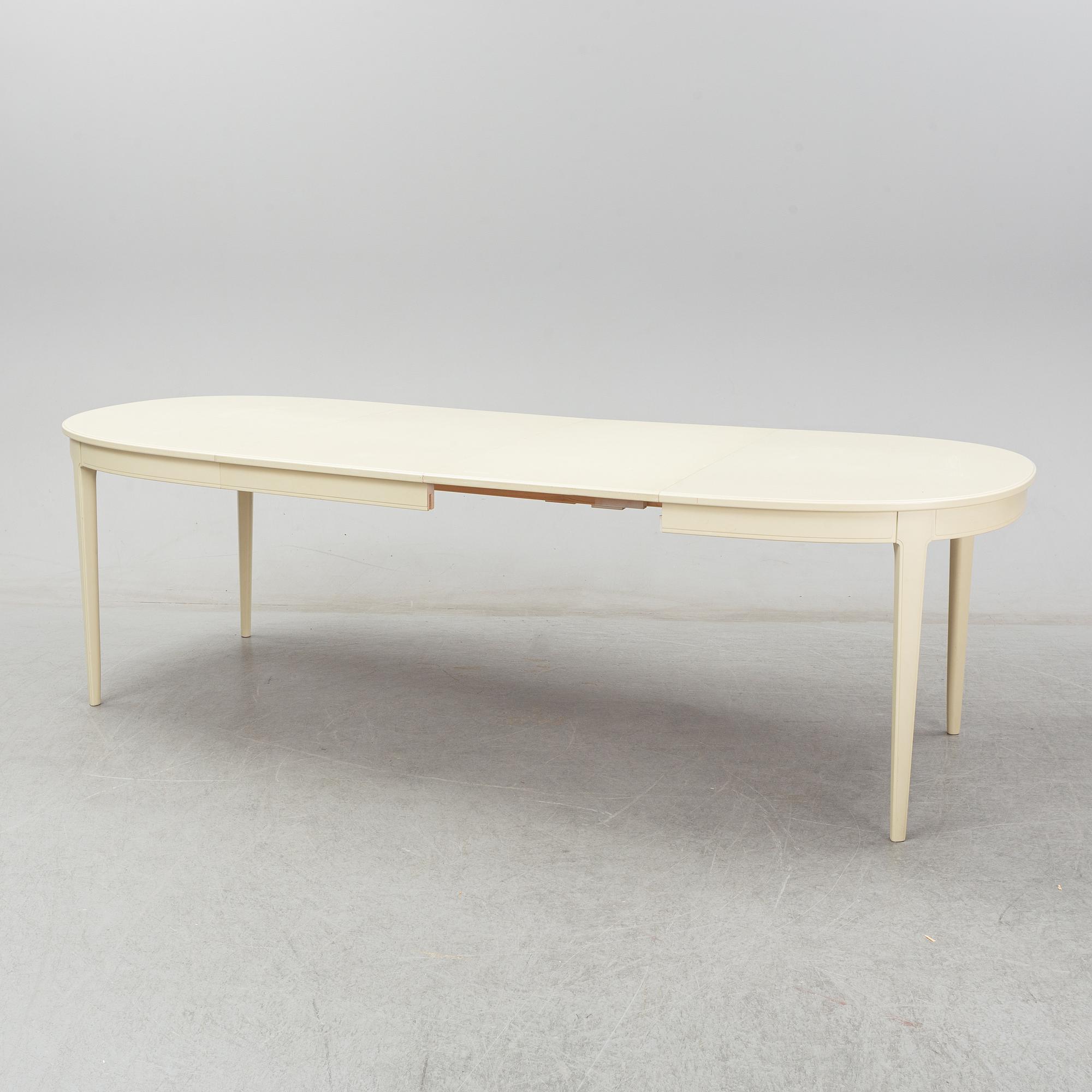 A dining table with six chairs by Carl Malmsten. Second half of the 20th Century.