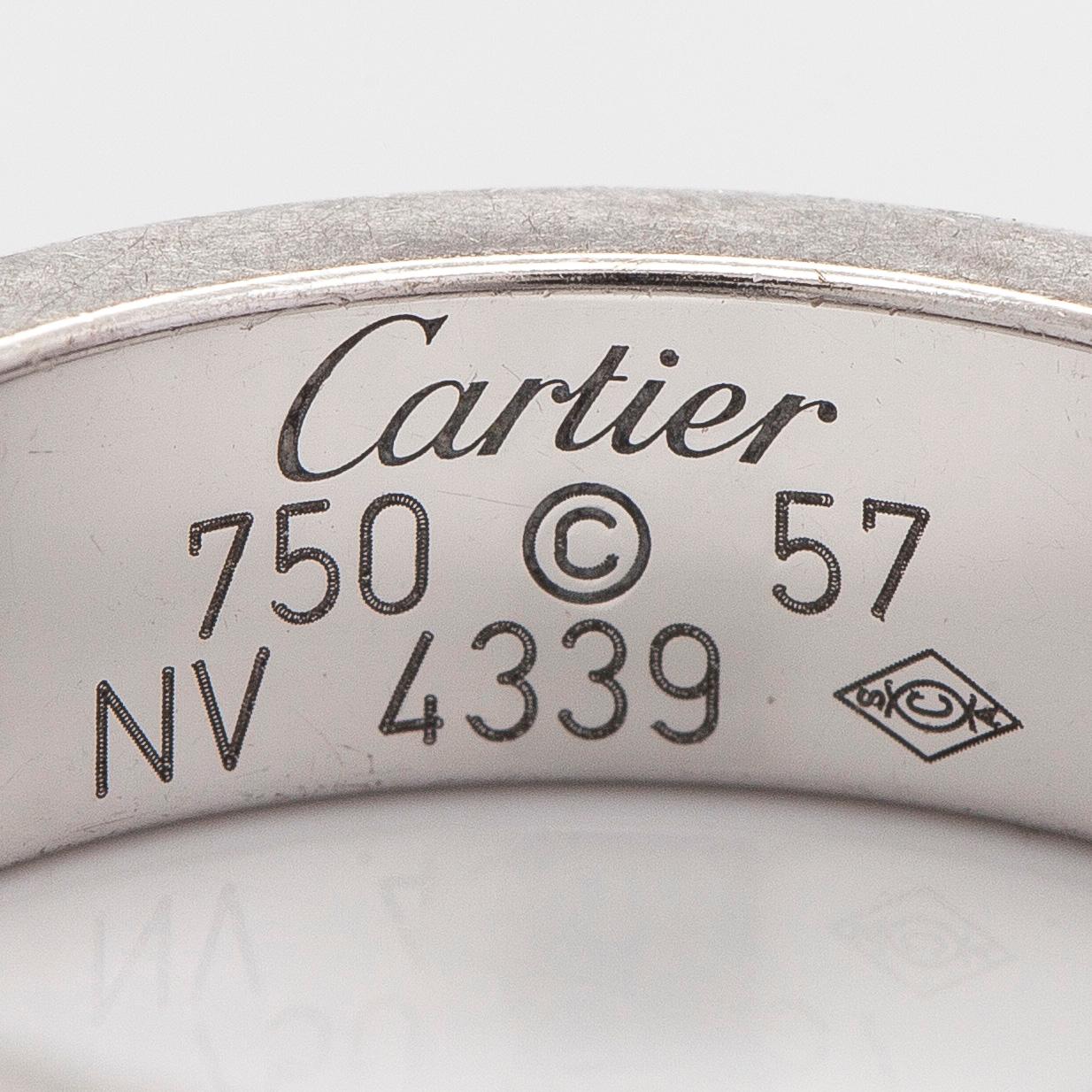 Cartier, sormus, "Love", 18K valkokultaa ja kolme briljanttihiottua timanttia.