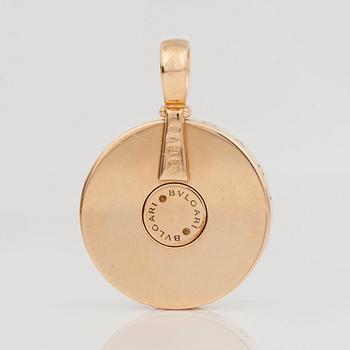 A Bulgari gold and mother of pearl spinning pendant.