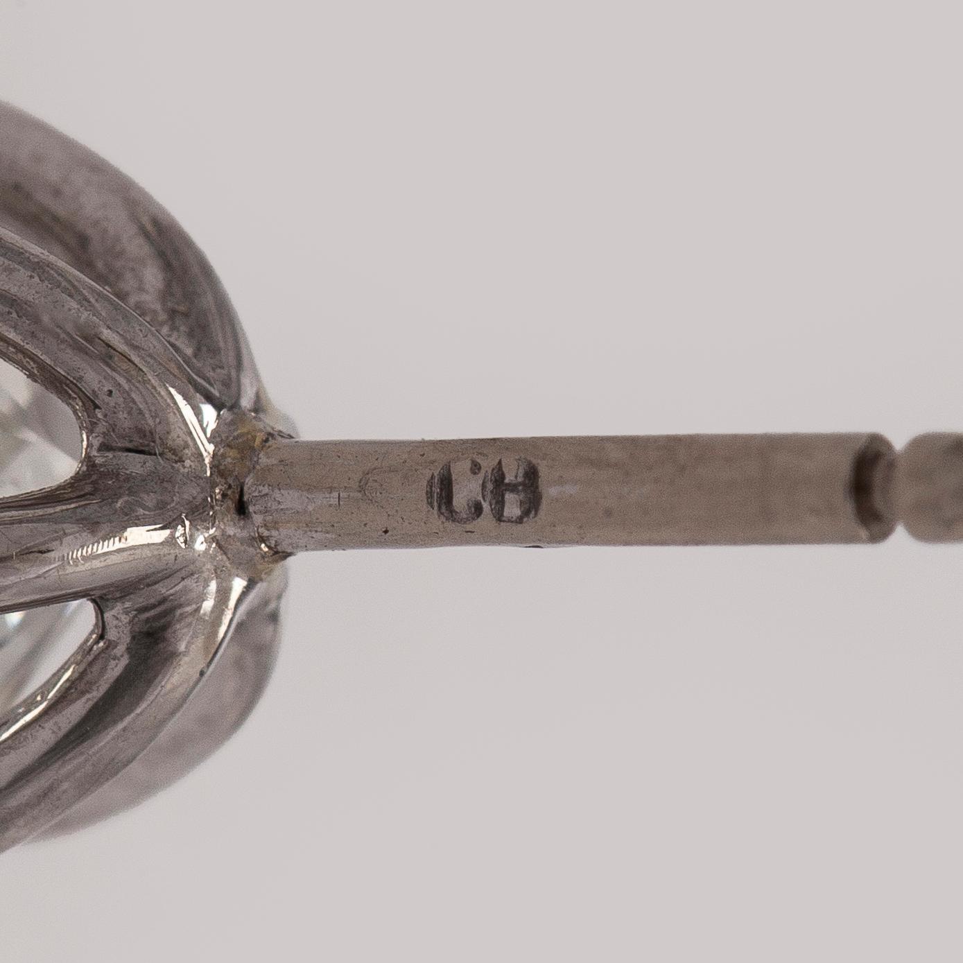 Bucherer, a pair of 18K white gold earrings with brilliant-cut diamond. SJL-certificate.