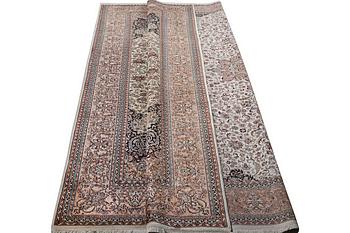 A carpet, silk Kashmir, c. 358 x 252 cm.