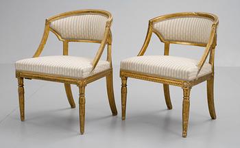 A pair of late Gustavian armchairs.