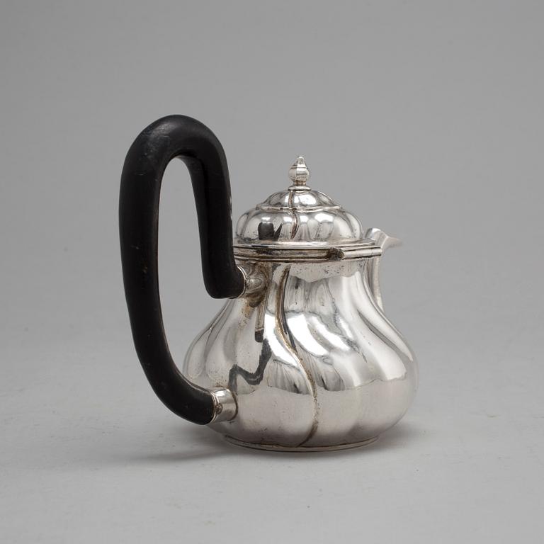 An 18th century silver tea pot, unidentified makers mark, Northern Europe.