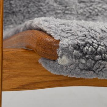 Yngve Ekström, A pair of armchairs, a footstool, “Lamino”, and a side table, Swedese, 2000s.
