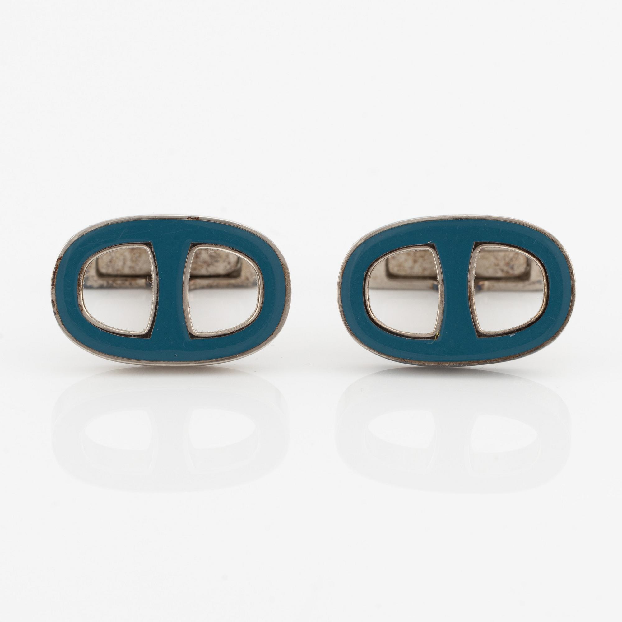 Hermès, manschettknappar, silverfärgad metall med emalj.