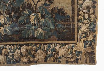 A 17th century Flemish 'verdur' entre-fenêtre tapestry, c. 268 x 130 cm.