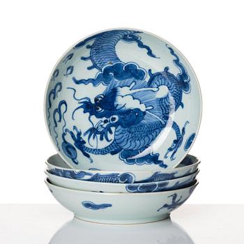 A set of four blue and white dragon dishes, Qing dynasty, 18th Century.