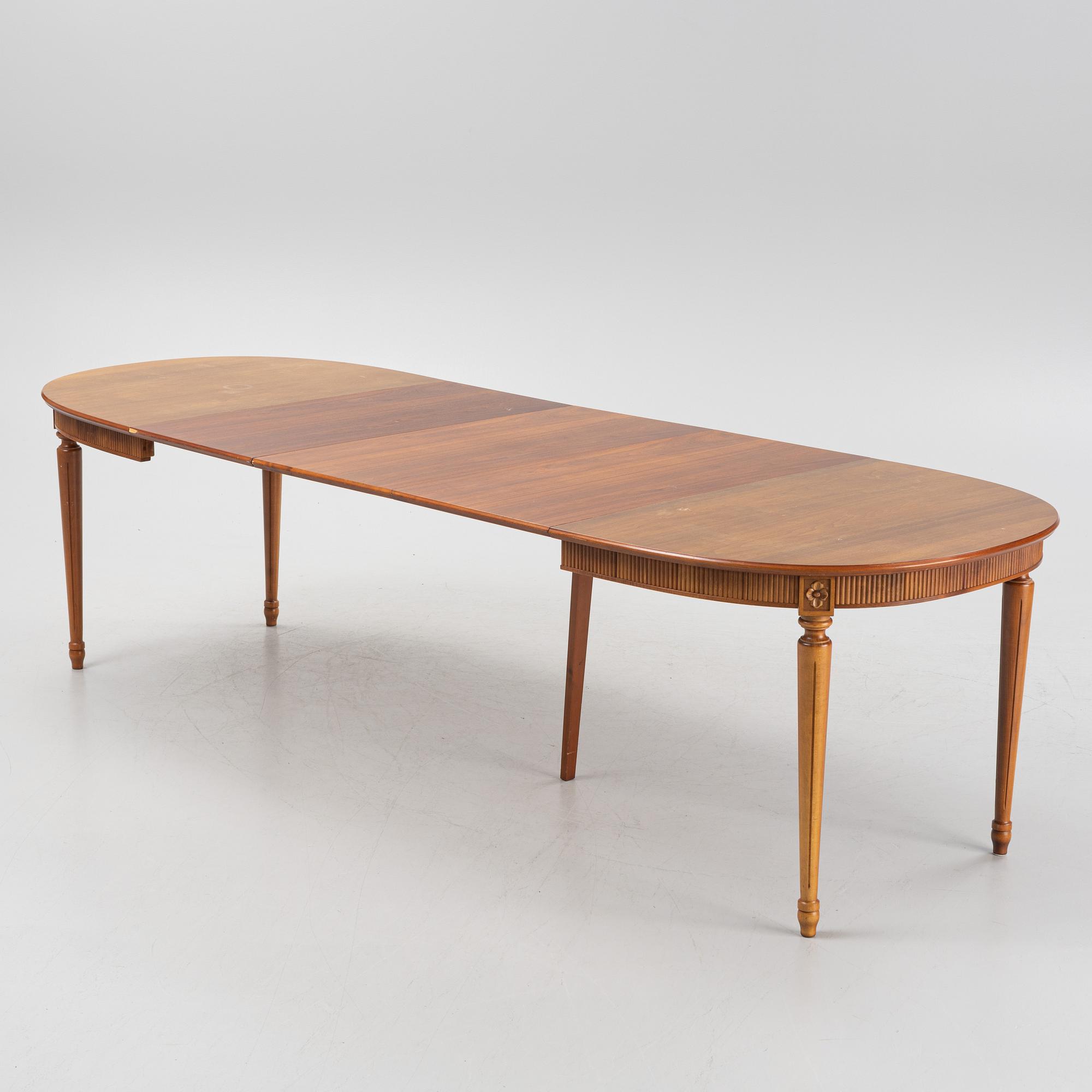 A Gustavian style dining table with two armchairs and four chairs, late 20th century.