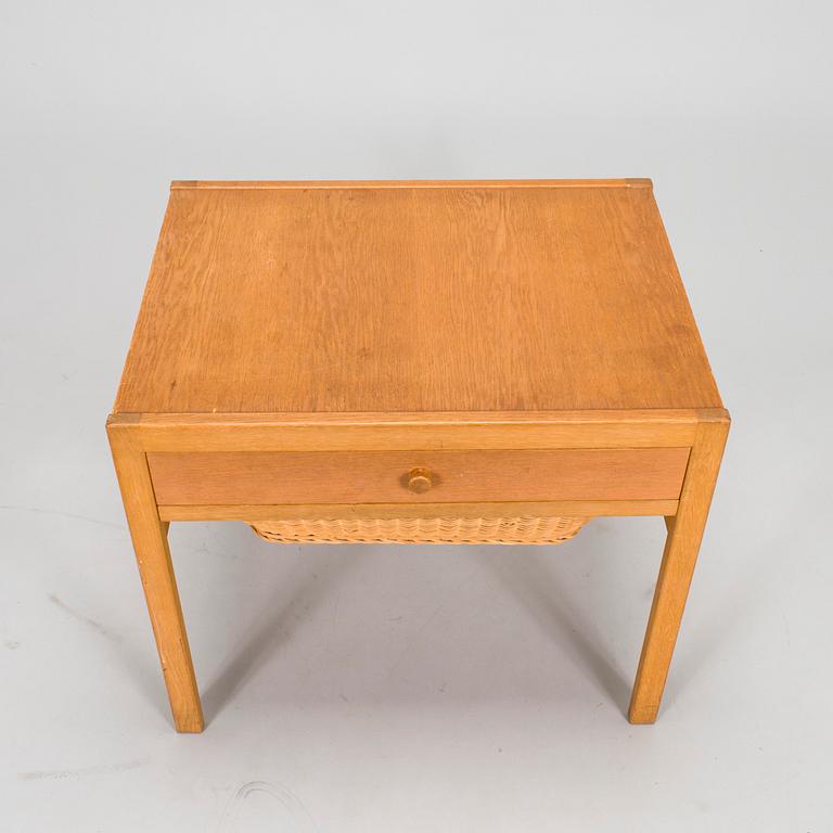 A mid-20th-century sewing table.