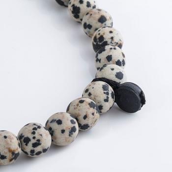 A necklace and clasp with briliant cut diamonds by Ole Lynggaard.