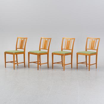 An oak dining table and four chairs by Carl Malmsten for Bodafors. Second half of the 20th Century.