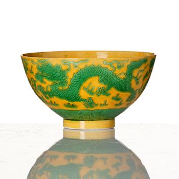 A yellow-ground green-enamelled 'dragon' and phoenix bowl, underglaze blue Daoguang seal mark and of the period.