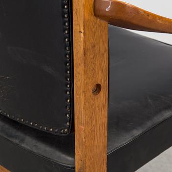 A treak and leather armchair by Sven Kai-Larsen, Sadelmakarmästarna, NK verkstäder.
