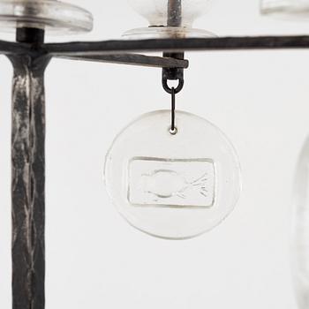 Erik Höglund, a iron and glass candelabra.