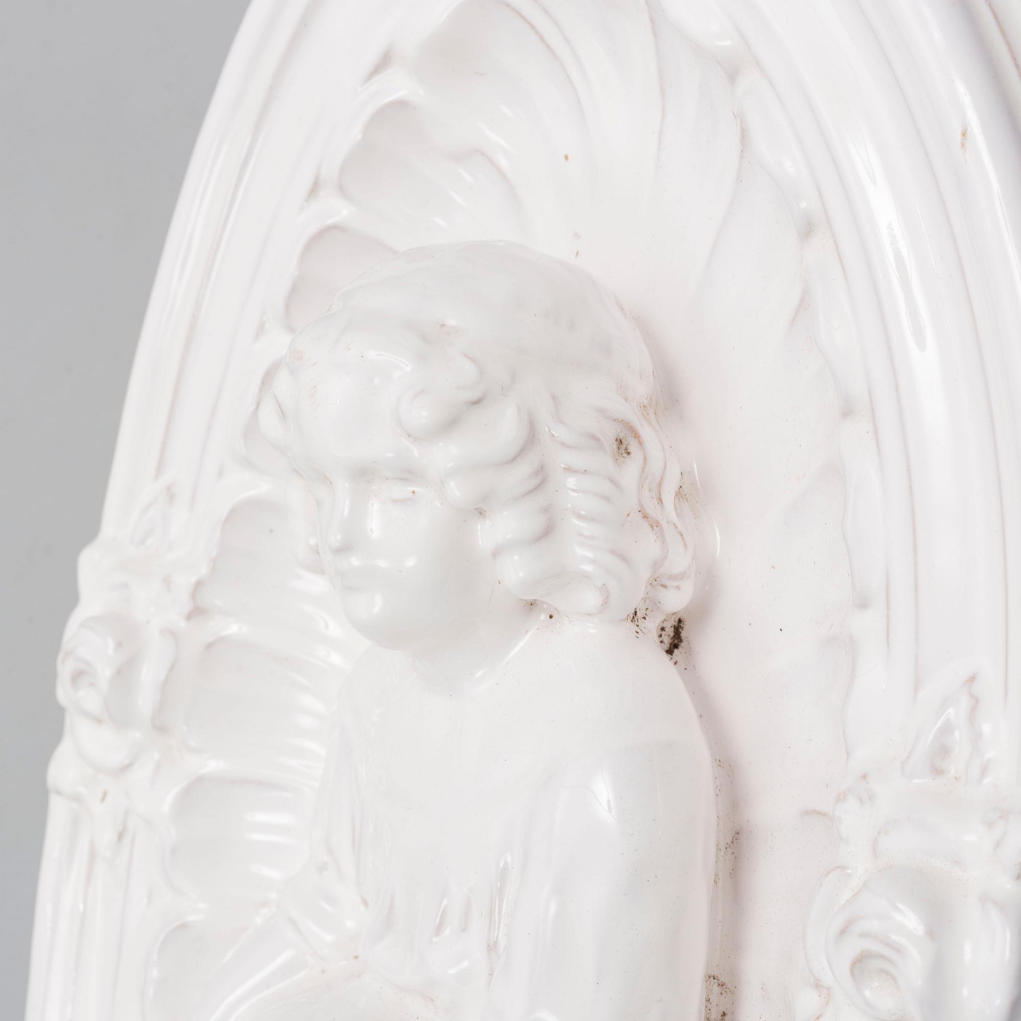 A ceramic wall relief, circa 1900.