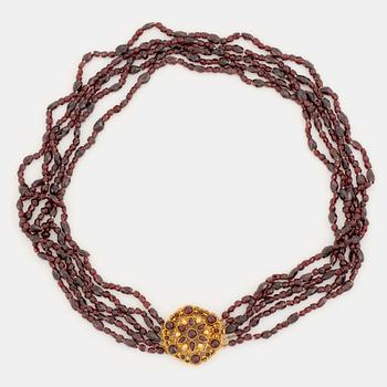 430. A five strand garnet necklace with a 14K gold clasp set with garnets.