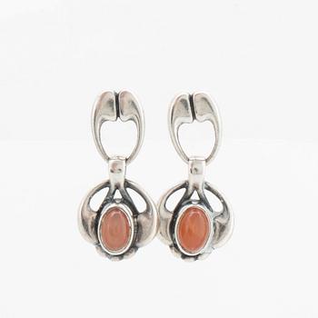 A silver and moonstone jewellery set consisting of necklace and earrings by Georg Jensen, jewellery of the year 2006.