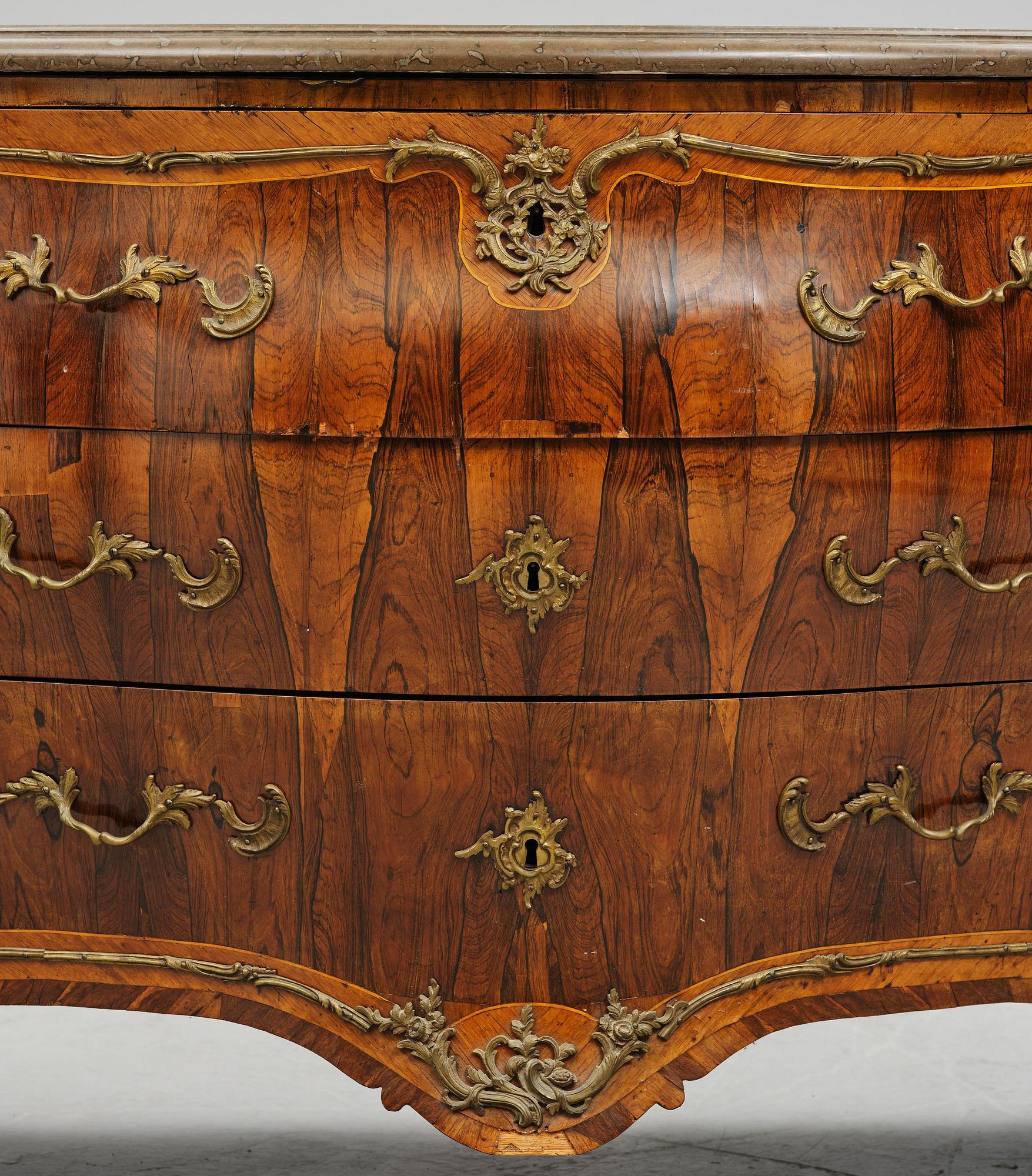 A rococo parquetry commode by C. G. Willkom (master in Stockholm 1763-65).
