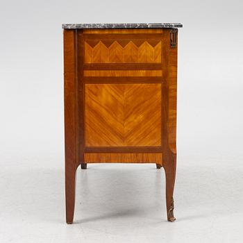 A Louis XVI style chest of drawers, France, circa 1900.
