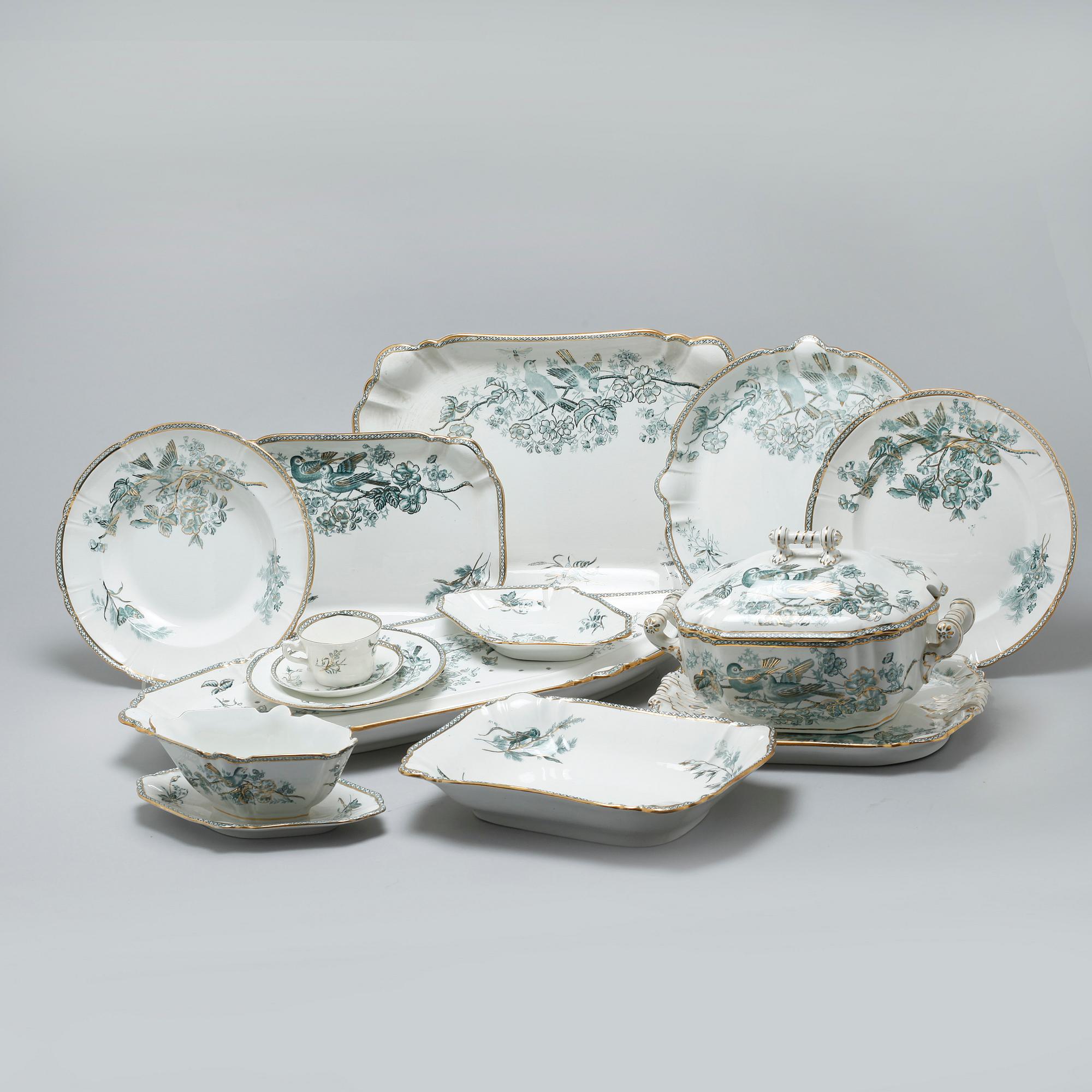 A earthenware table set of 136 pcs "Vexiö Guld",  by Arvid Ekberg, Gustafsberg, from around year 1900.