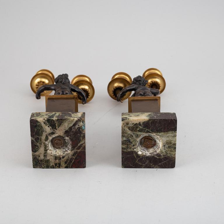 A pair of bronze empire style candleabra, 20th century.