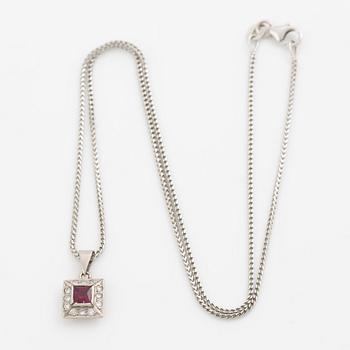 Pendant with chain in 18K white gold featuring a red stone, likely a ruby, and diamonds.