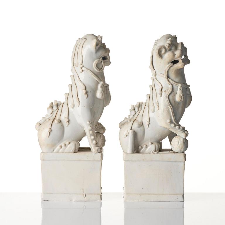 A pair of Chinese blanc de Chine 'Buddhist lion' joss stick holders, Qing dynasty, Kangxi (1662-1722).