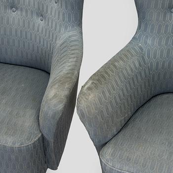 A pair of mid-20th century armchairs.