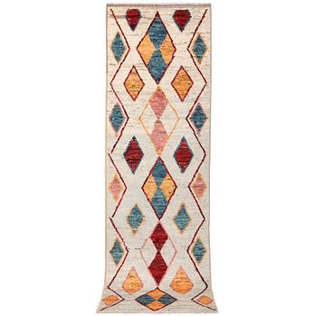 A Moroccan runner carpet, c. 297 x 81 cm.