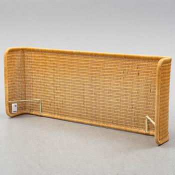 A late 20th century rattan bedside.