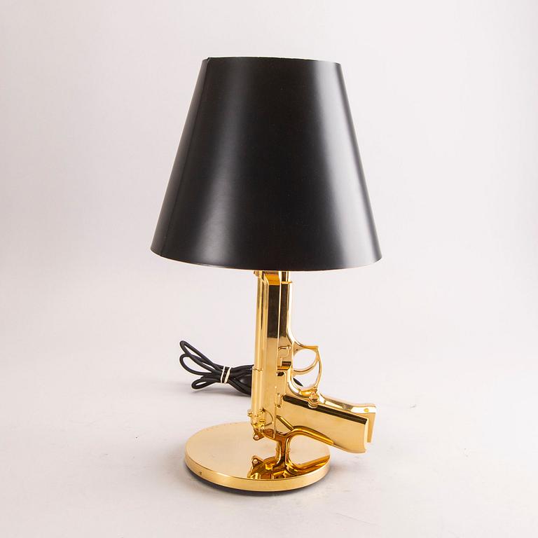 Philippe Starck, bordslampa, "Gun bedside Lamp", Flos, formgiven 2005.