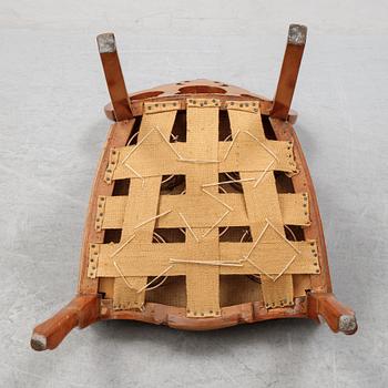 A rococo style sofa, four chairs and a table, second half of the 19th Century.