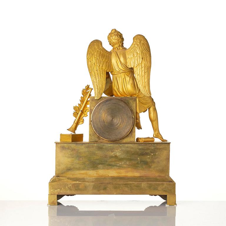 A figural Empire ormolu mantel clock, Paris, early 19th century.