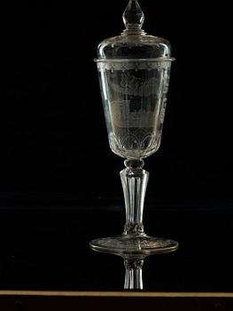 A cut and engraved glass goblet with cover, 18th Century.