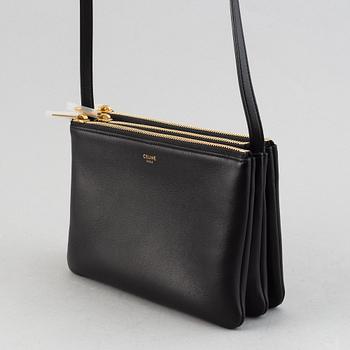 Céline, a black leather 'Trio Bag'.