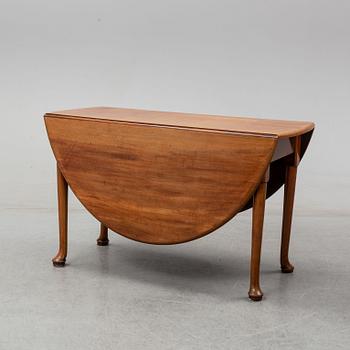 An end of the 19th Century mahogany drop leaf table.