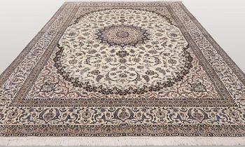 A Nain part silk carpet, 407 x 304 cm.